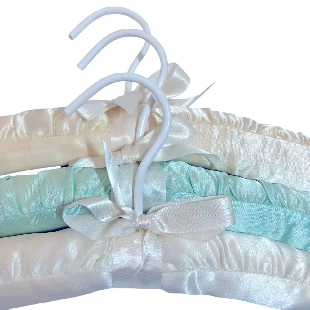 Three Luxurious Padded Satin Hangers-2 Cream and 1 Soft Blue Hanger.